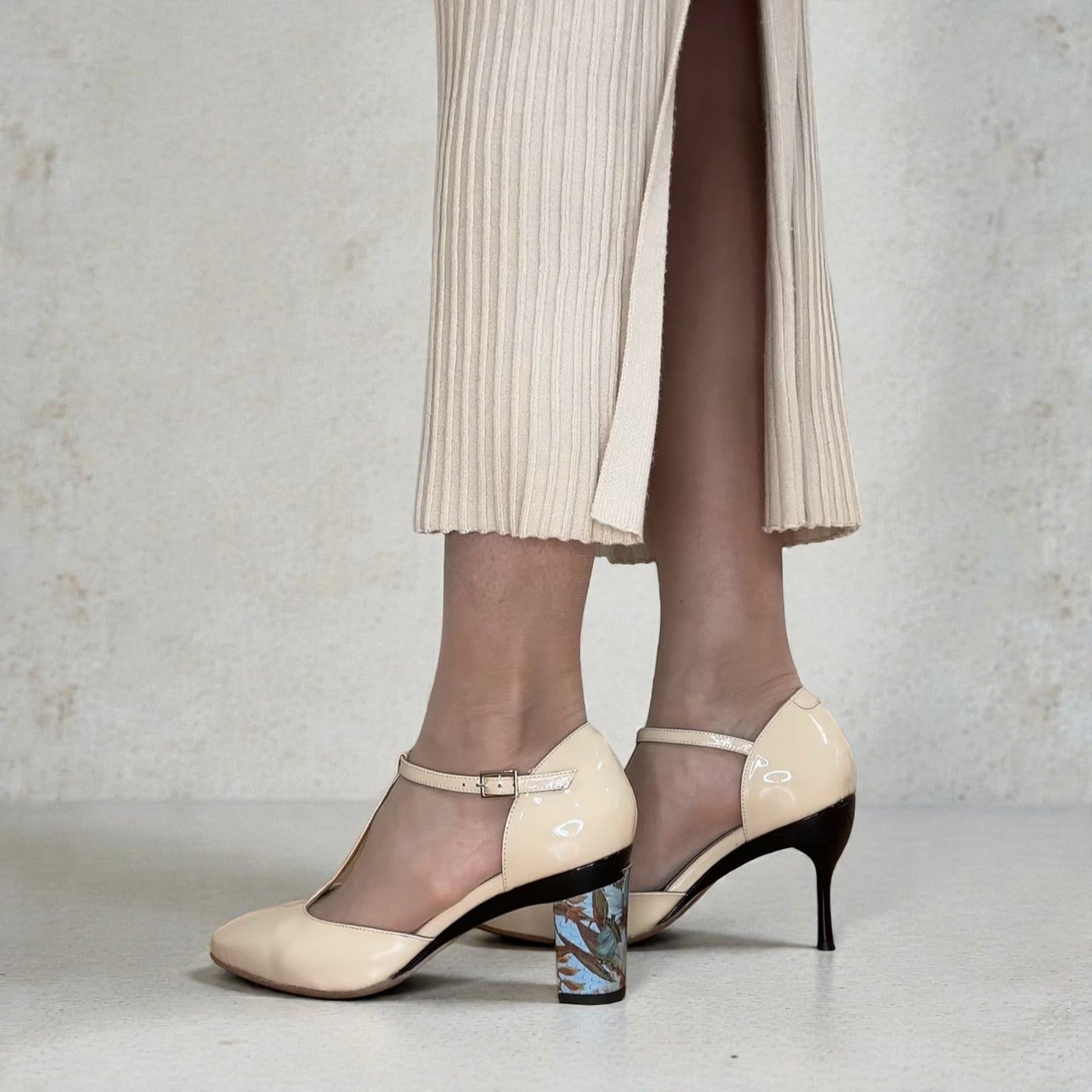 Tanya heath us nude t-strap pump with two different interchangeable heels. floral print 2.6" block heel and black stiletto heel