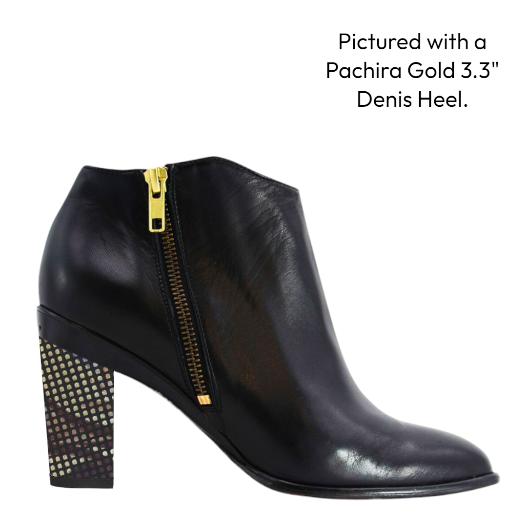 Black leather ankle side xzip boot with gold zipper. purple heel. white background